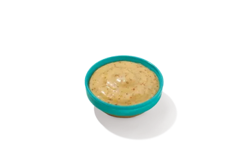 Mardi Gras Mustard in a bowl, featuring a vibrant yellow color, perfect for adding a tangy, spicy kick to your meals.