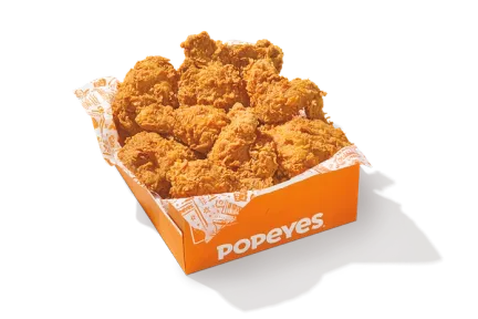 Sixteen pieces of Popeyes signature fried chicken in a box.