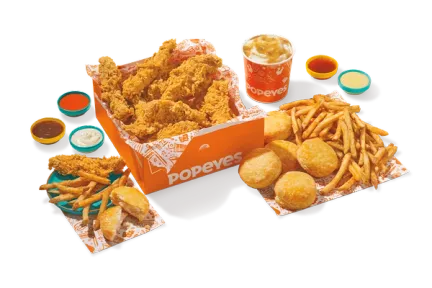 Sixteen Popeyes chicken tenders with three large sides.