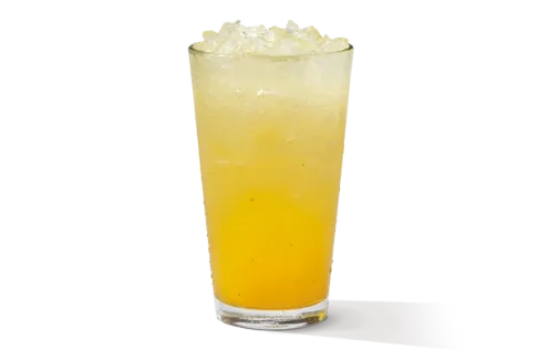 Mango Lemonade in a glass, showcasing a vibrant yellow color with slices of fresh mango for a tropical twist.