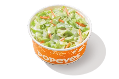 Coleslaw in a serving bowl, featuring a mix of crisp cabbage and carrots tossed in a creamy dressing for a refreshing side.